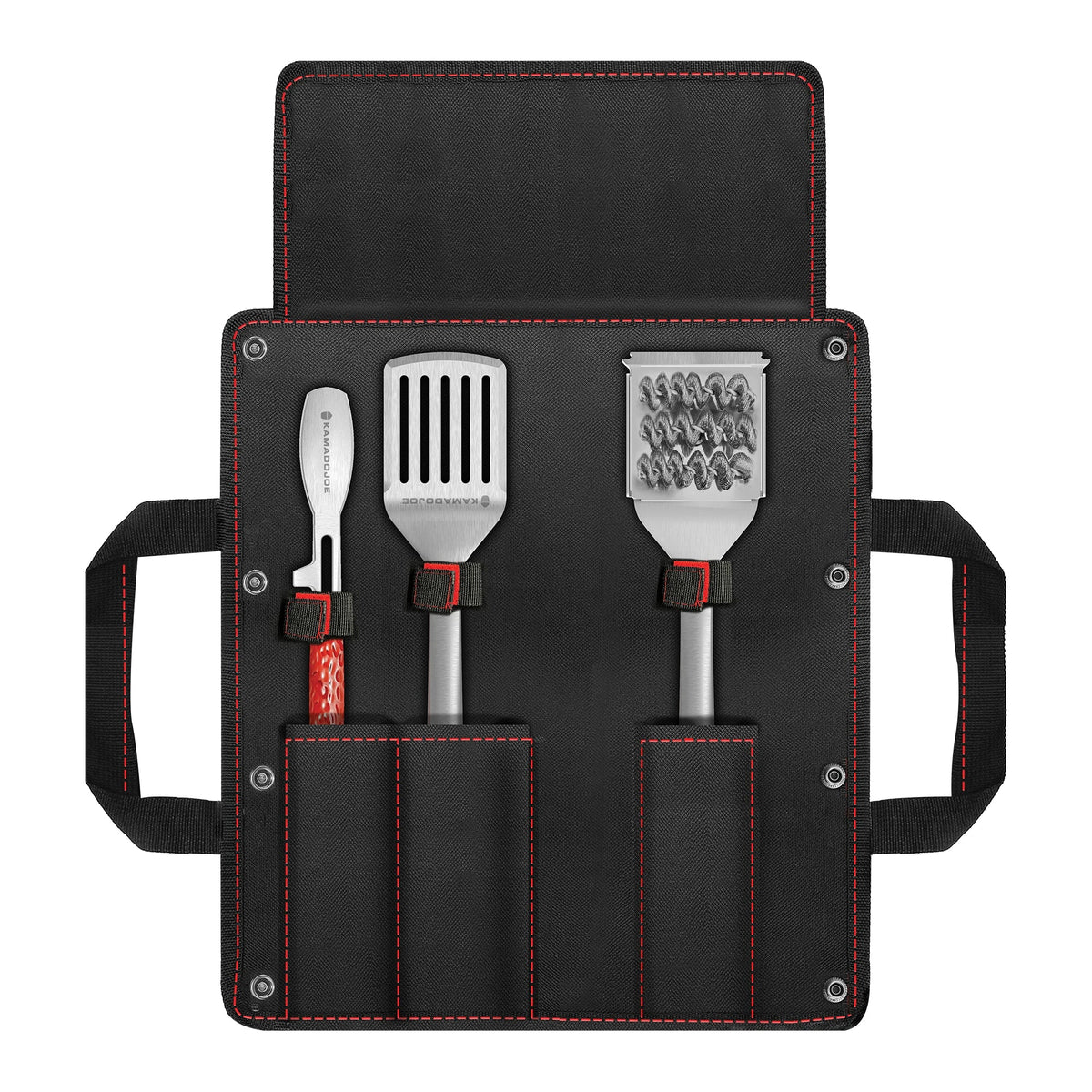 Set of three Kamado Joe kitchen tools (tongs, spatula, bristle brush) in a black carrying case with red stitching and side handled on a white background